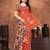 Earthy terracotta saree with artistic floral pallu