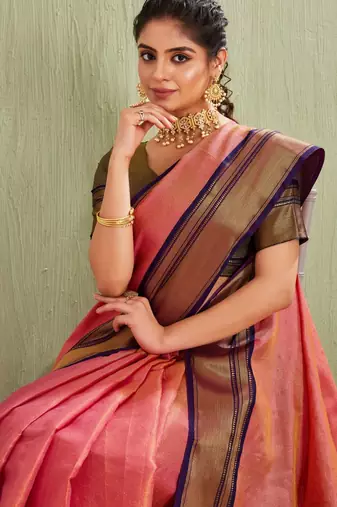 Elegant pink and olive traditional saree with striped pallu
