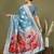 Sky blue floral linen cotton saree with zari border and digital printed pallu