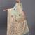 light green linen cotton saree with woven pallu butta work and tassels