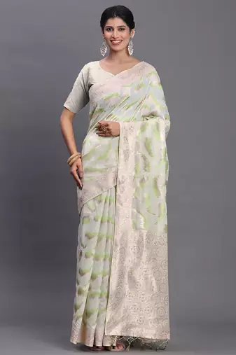 cream linen cotton saree with light green pallu and contrast blouse piece