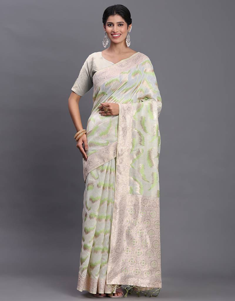 cream linen cotton saree with light green pallu and contrast blouse piece