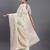 cream linen cotton saree with light green pallu and contrast blouse piece