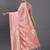 Peach linen cotton saree with silver zari weave and tassels