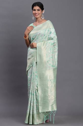 Sea green linen cotton saree with silver zari weave and tassels