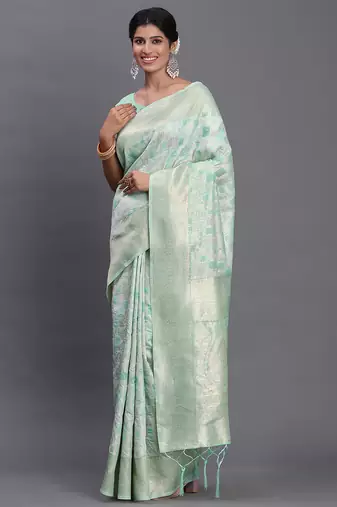 Sea green linen cotton saree with silver zari weave and tassels