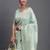 Sea green linen cotton saree with silver zari weave and tassels