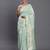 Sea green linen cotton saree with silver zari weave and tassels