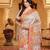 woven linen cotton saree with intricate patterns and tassel