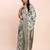 off-white green linen cotton saree with zari woven border