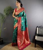 Green silk blend woven butta weaving banarasi saree with zari border