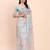 Sea green cotton cotton saree with tribal floral print