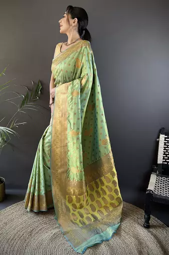 Light green silk blend copper zari weaving banarasi saree with contrast blouse
