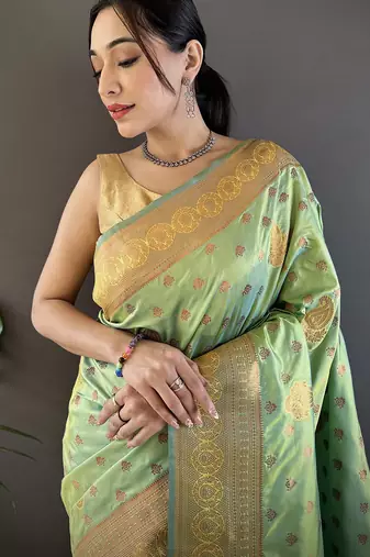Light green silk blend copper zari weaving banarasi saree with contrast blouse