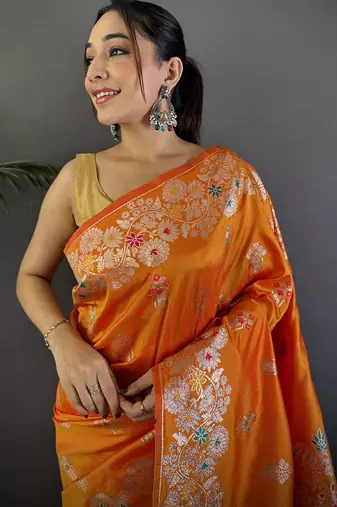 Orange silk blend floral zari weaving meenakari saree with floral border