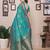 Light green silk blend copper zari butta weaving banarasi saree with zari border