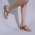 Beige embroidered leather block heels