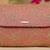 Pink floral embroidered clutch