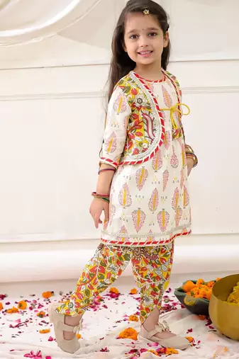 Yellow printed cotton kurti dhoti with jacket set for girls