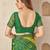 Green bandhani work chiffon saree with border detailing and unstitched blouse