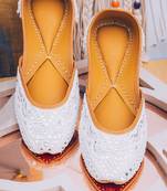 White embroidered leather juttis