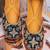 Black embroidered leather juttis
