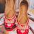 Red embroidered leather juttis