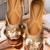 Gold embroidered leather juttis
