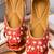 Red embroidered leather juttis