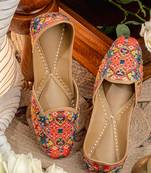 Red embroidered leather juttis