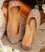 Peach embroidered leather juttis