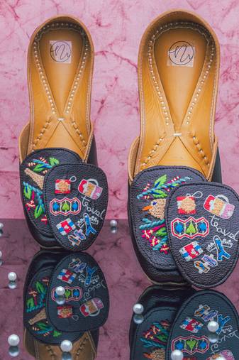 Navy blue embroidered leather juttis