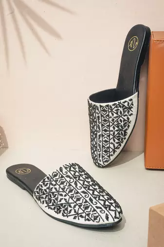 Black embroidered leather mules