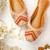 Beige embroidered leather juttis