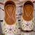 Pink embroidered leather juttis