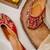 Red embroidered leather juttis