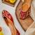 Red embroidered leather juttis