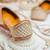 Beige embroidered leather juttis