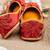 Red embroidered leather juttis