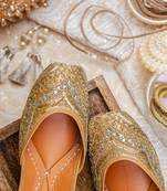 Gold embroidered leather juttis
