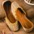 Gold pearl embroidered leather juttis