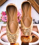 Beige embroidered leather juttis