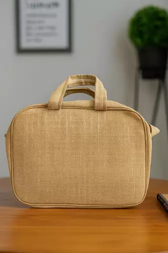 Beige woven design jute laptop bag