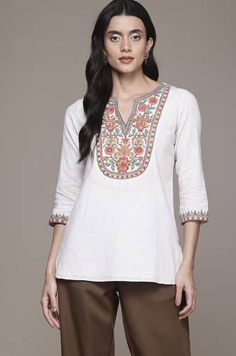 white cotton kurta with embroidered work design