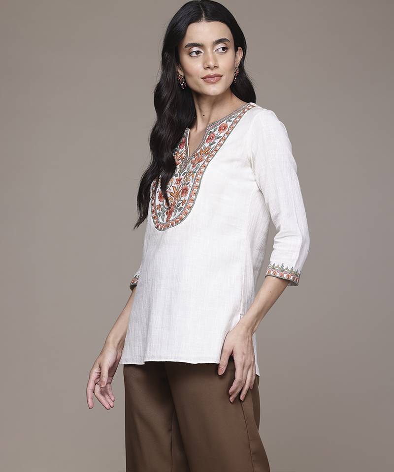white cotton kurta with embroidered work design