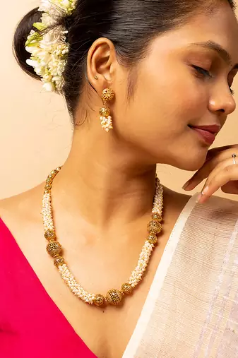 Pearl-adorned gold-tone long necklace & earrings set
