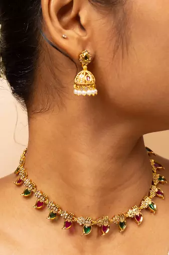 Gold-tone necklace with green & white stone accents & matching stud earrings
