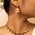 Gold-tone necklace with green & white stone accents & matching stud earrings