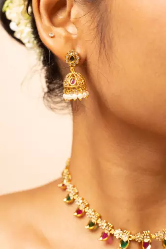 Gold-tone necklace with green & white stone accents & matching stud earrings