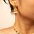 Gold-tone necklace with green & white stone accents & matching stud earrings